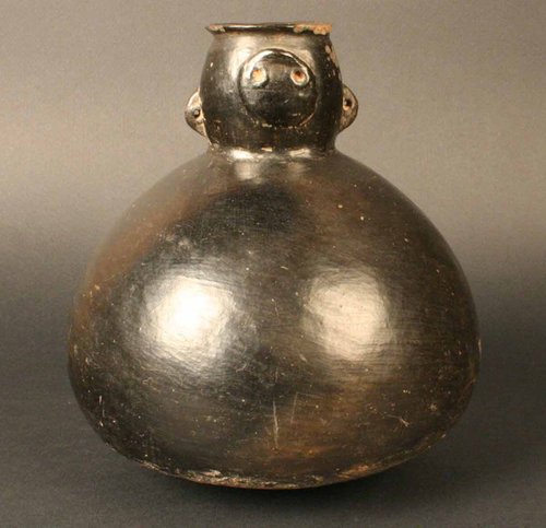 Botella con rostro antropomorfo